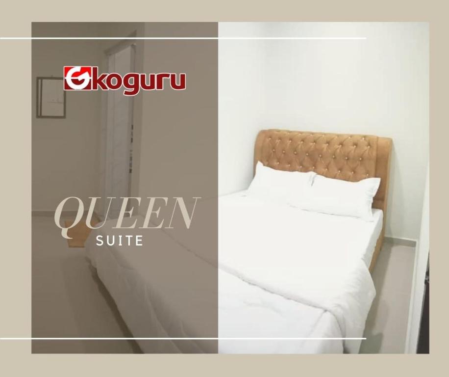 Postel nebo postele na pokoji v ubytování TAMU ROOMSTAY TOK MOLOR