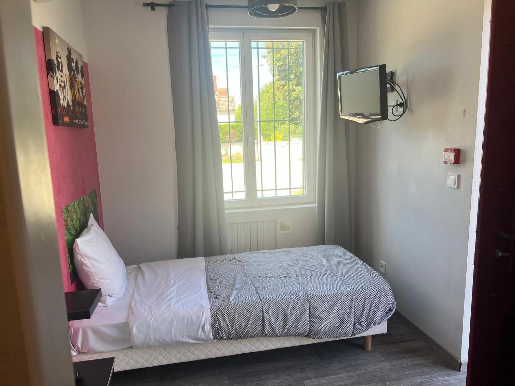 Postel nebo postele na pokoji v ubytování Hôtel des 2 Gares