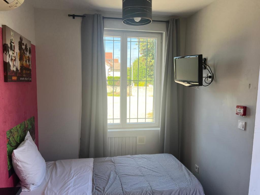 Postel nebo postele na pokoji v ubytování Hôtel des 2 Gares