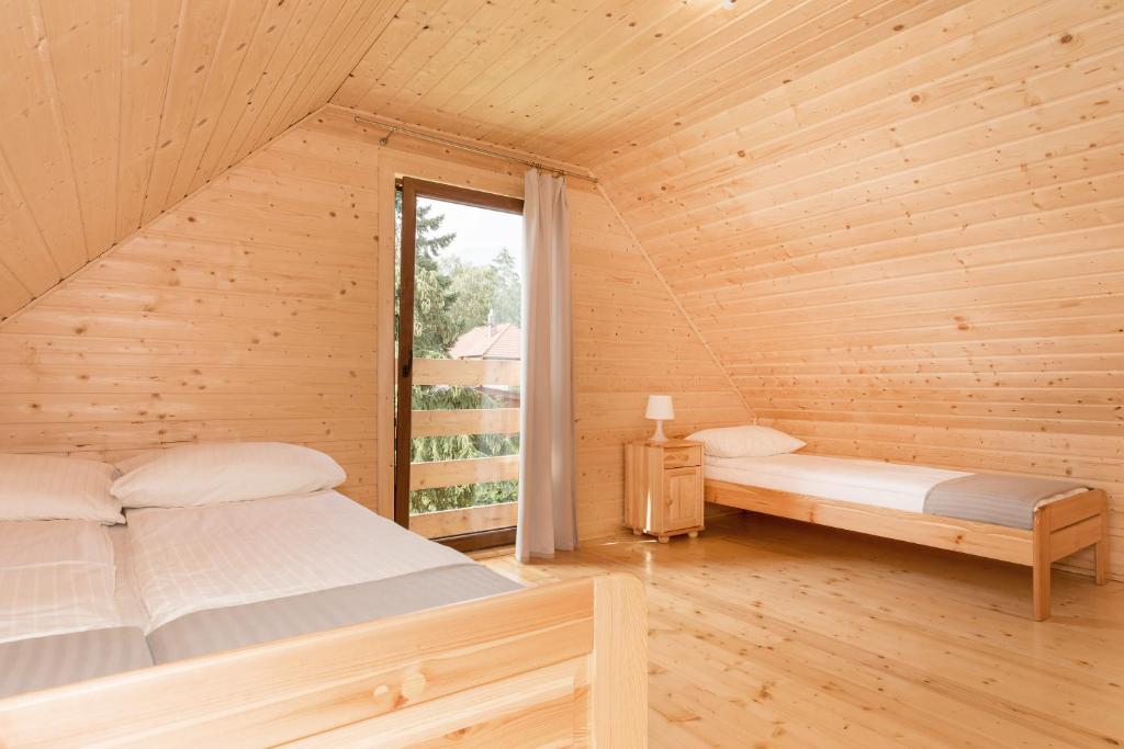 Postel nebo postele na pokoji v ubytování O.W. Laguna