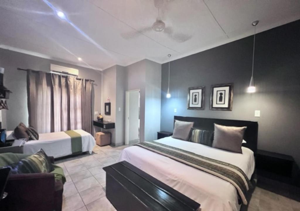 Letto o letti in una camera di Turaco Lodge - No Loadshedding