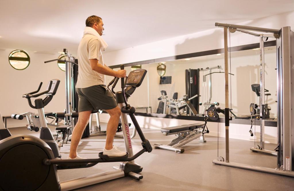 a man walking on a treadmill in a gym at Bluesun Holiday Village Bonaca - Full Board Plus in Bol