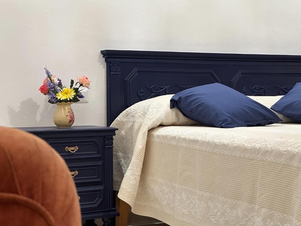 מיטה או מיטות בחדר ב-La residenza del sindaco