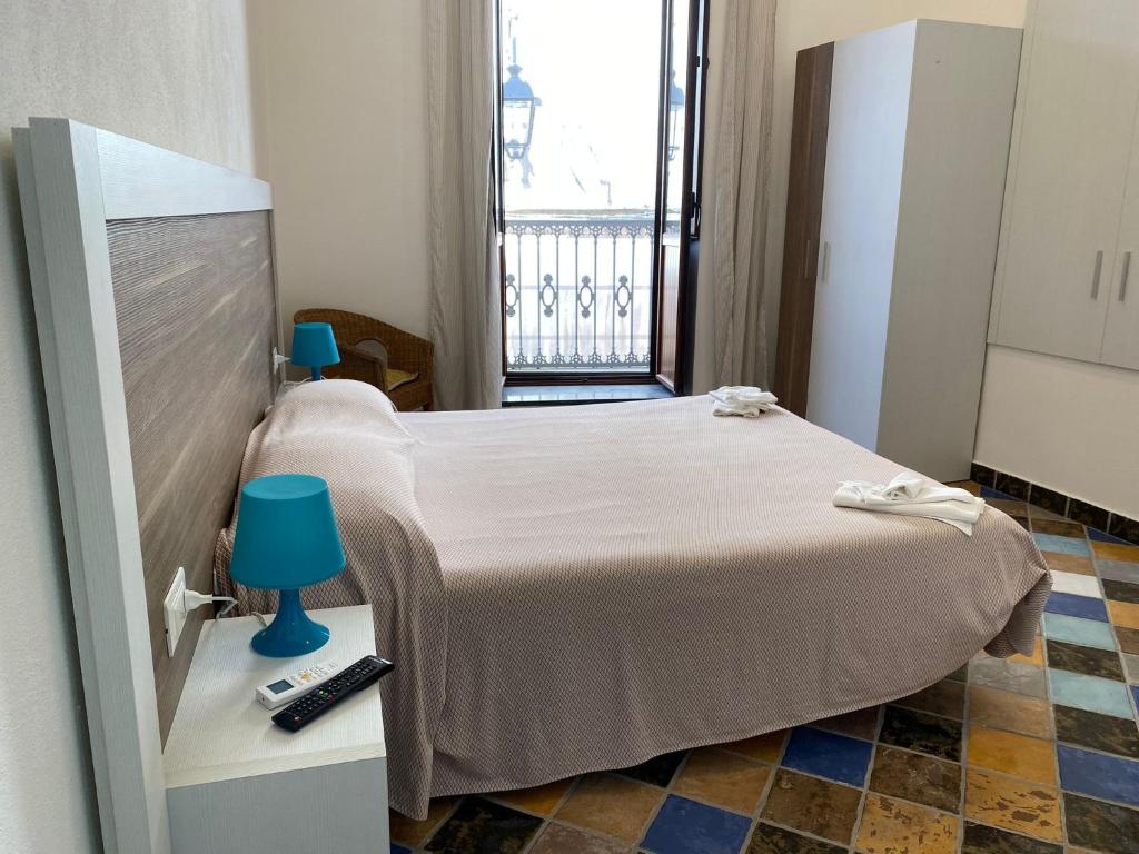 Postel nebo postele na pokoji v ubytování B&B La Torre