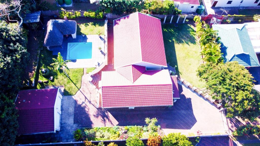 an overhead view of a house with a red roof at The Donga House - Luxury Home near Scottburgh Beach in Scottburgh