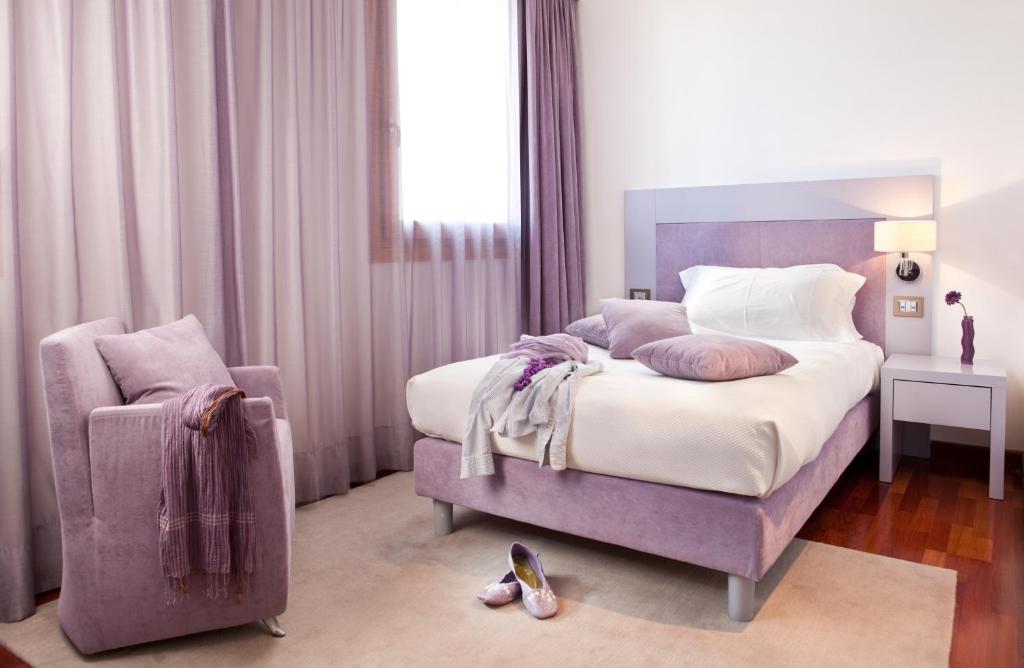 Posteľ alebo postele v izbe v ubytovaní Al Tezzon Hotel