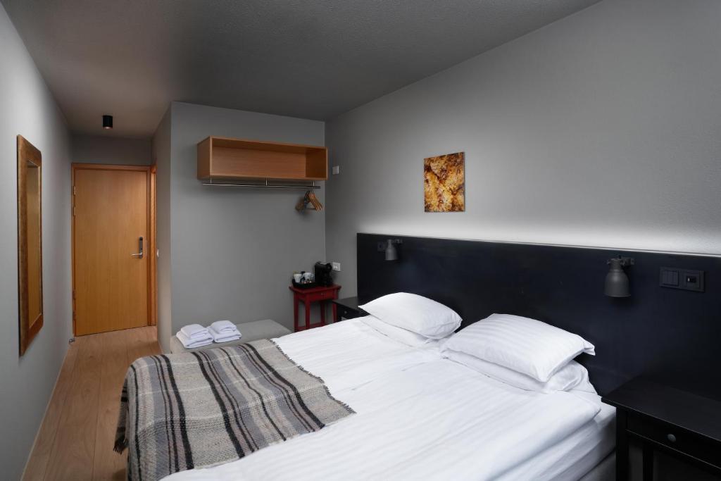 Postel nebo postele na pokoji v ubytování Höfn - Berjaya Iceland Hotels