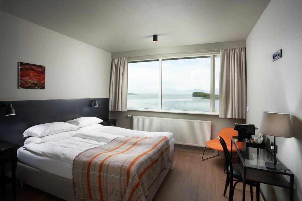 Postel nebo postele na pokoji v ubytování Höfn - Berjaya Iceland Hotels