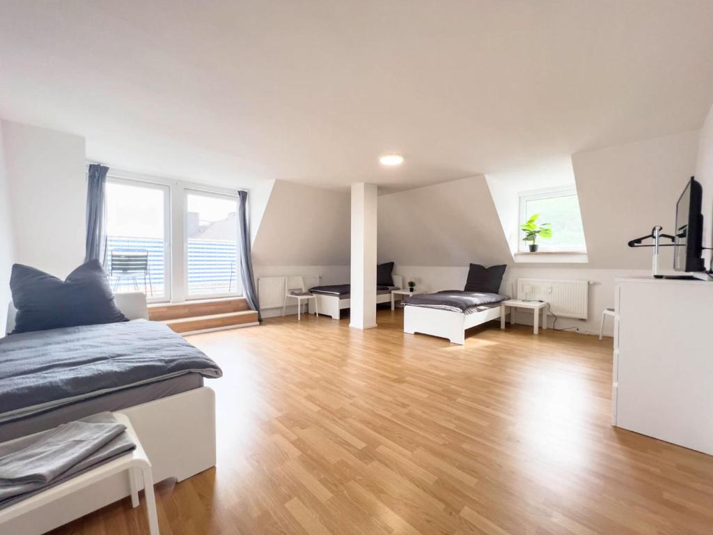 a bedroom with a bed and a living room at Nice Apartment in Wetzlar in Wetzlar