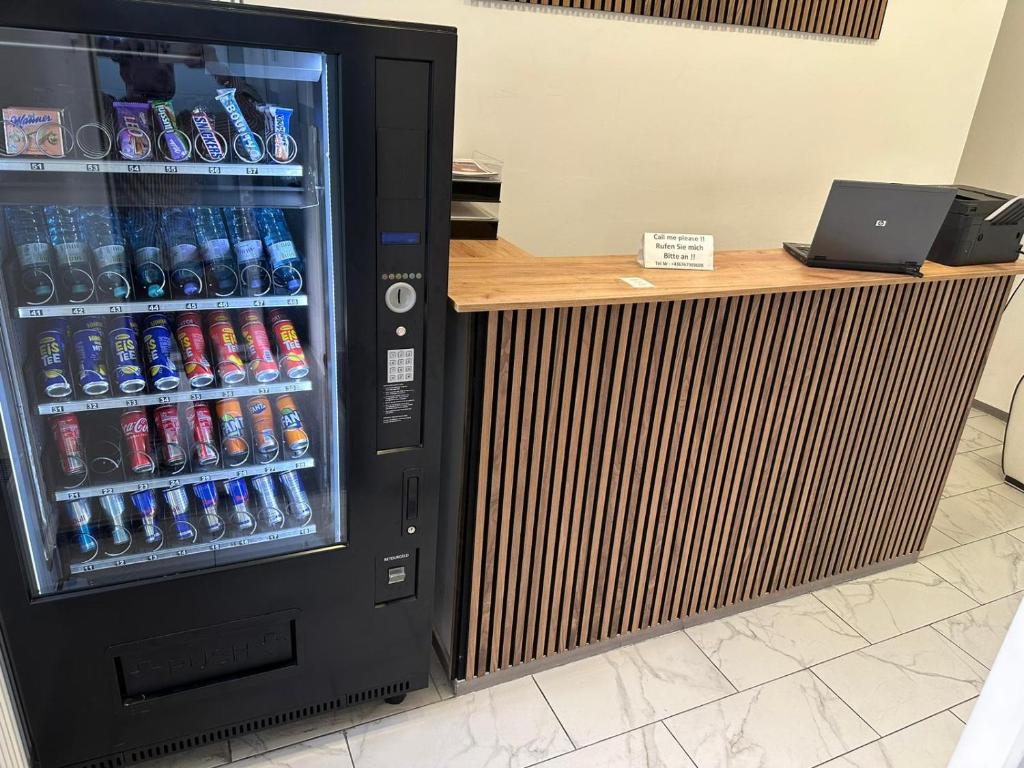 a vending machine filled with lots of soda bottles at Aparthotel Residence in Vienna