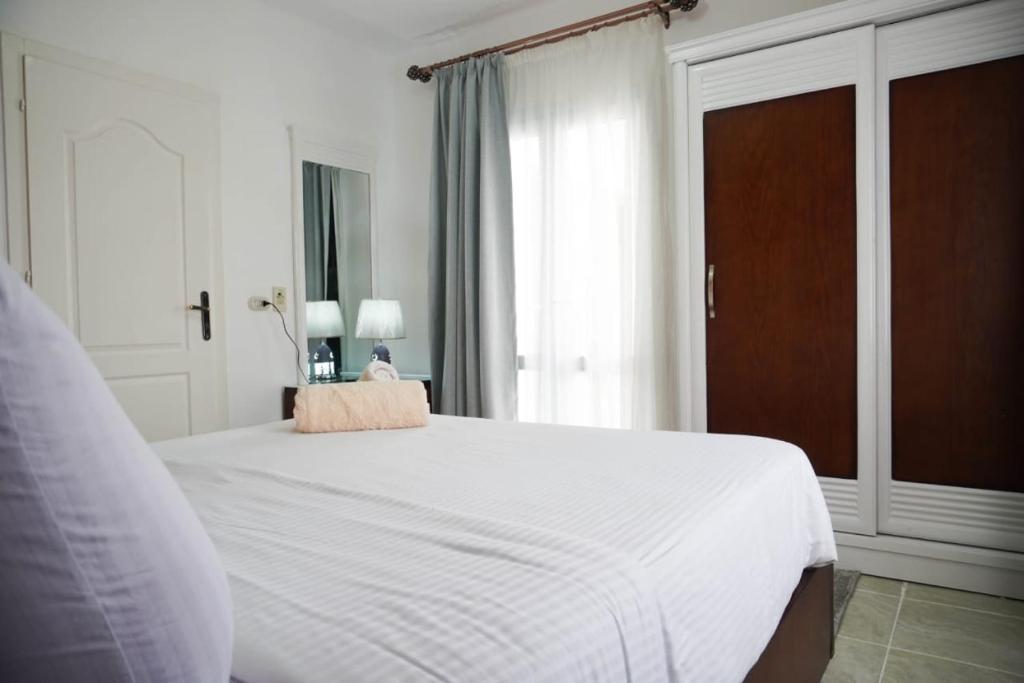 A bed or beds in a room at Delta sharm resort