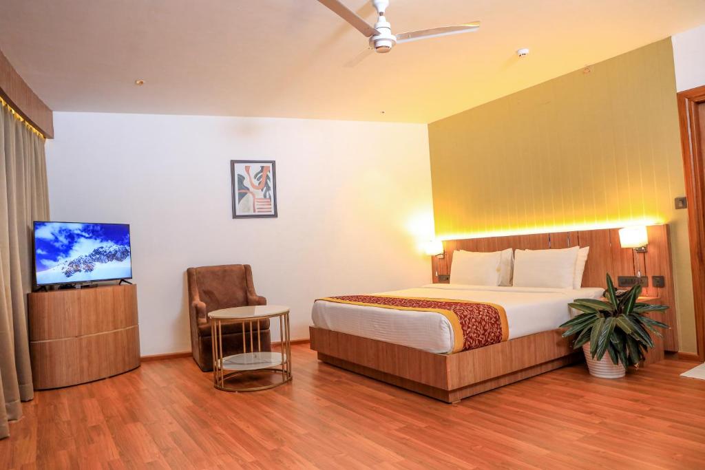 Postel nebo postele na pokoji v ubytování Hotel Sky Sierra Wayanad