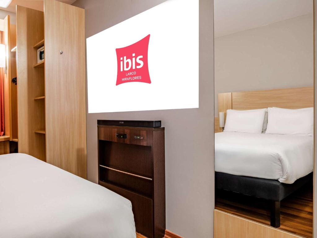 Postel nebo postele na pokoji v ubytování ibis Lima Larco Miraflores