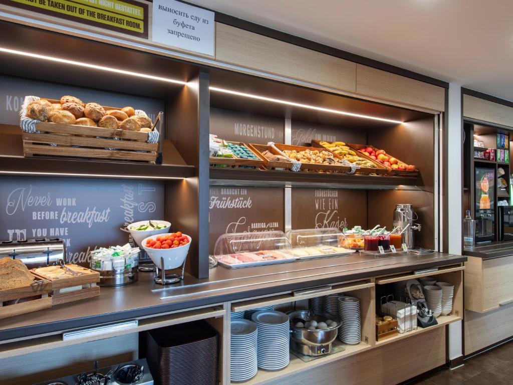 a bakery with many different types of food on display at B&B Hotel Regensburg-City in Regensburg