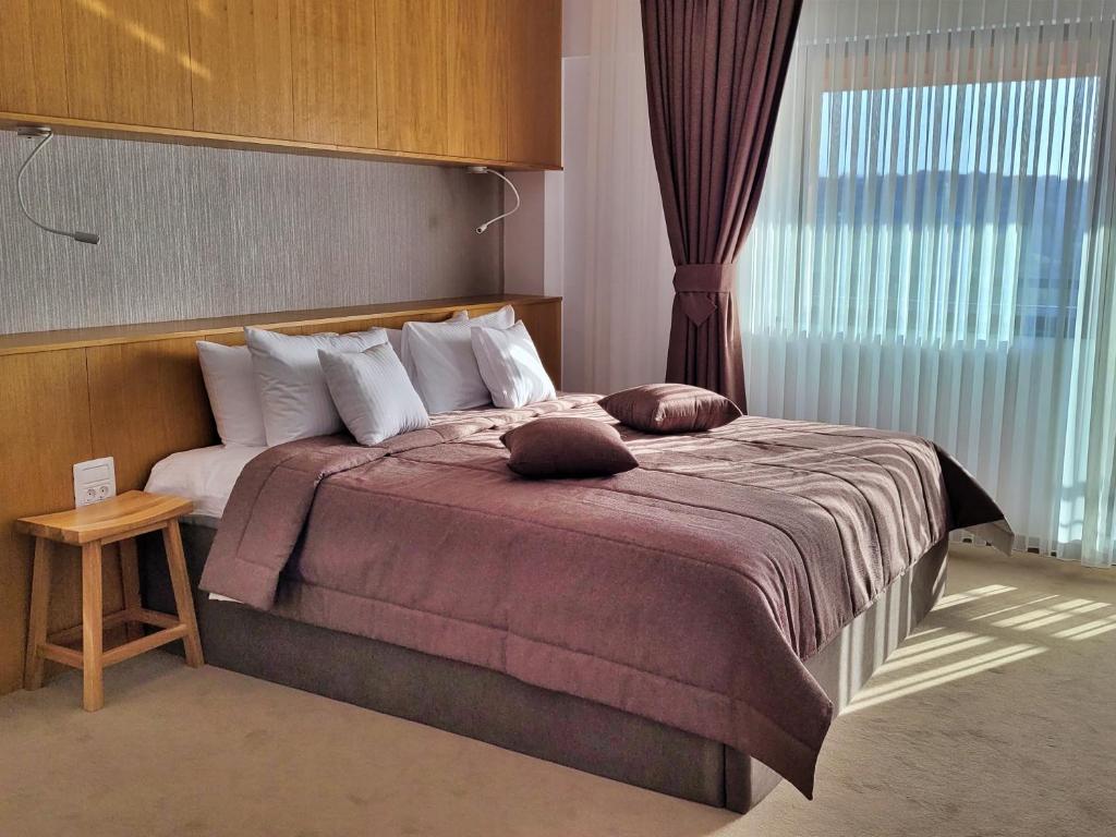 Postel nebo postele na pokoji v ubytování Hotel Condor Tulcea