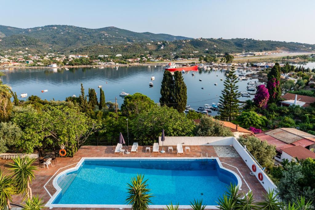 a swimming pool with a view of a lake at Anamar Skiathos Hotel in Punta
