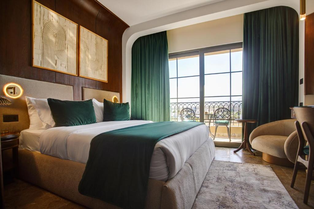Postel nebo postele na pokoji v ubytování Bratus Hotel