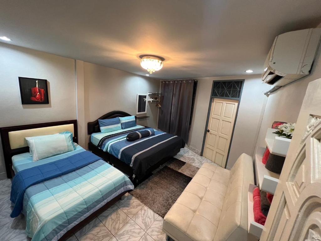 Postel nebo postele na pokoji v ubytování Sawasdee hatyai City House