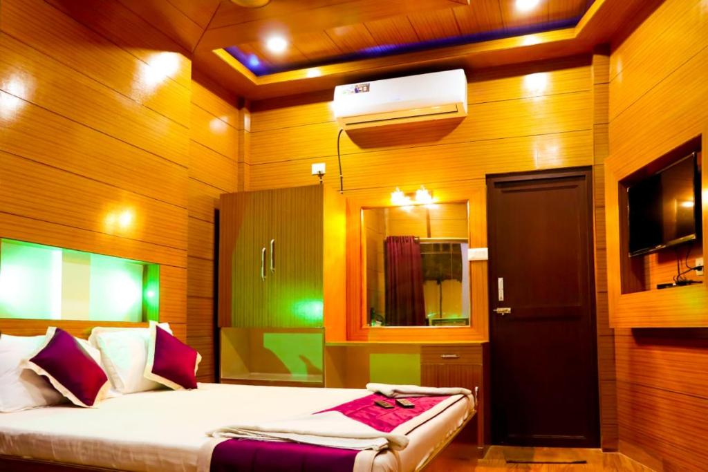 Katil atau katil-katil dalam bilik di Coral Garden Resort