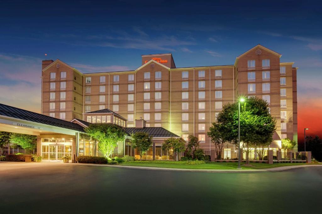 a rendering of a hotel at night at Hilton Garden Inn Louisville Airport in Louisville