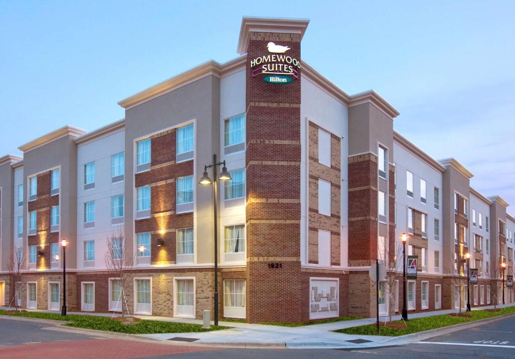 a building with a clock tower on the side of it at Homewood Suites Charlotte Ayrsley in Charlotte