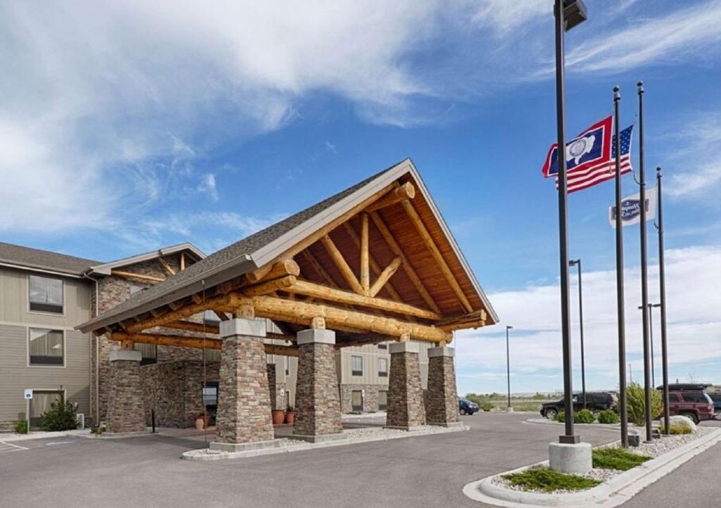 a building with awning and flags in front of it at Hampton Inn & Suites Pinedale in Pinedale