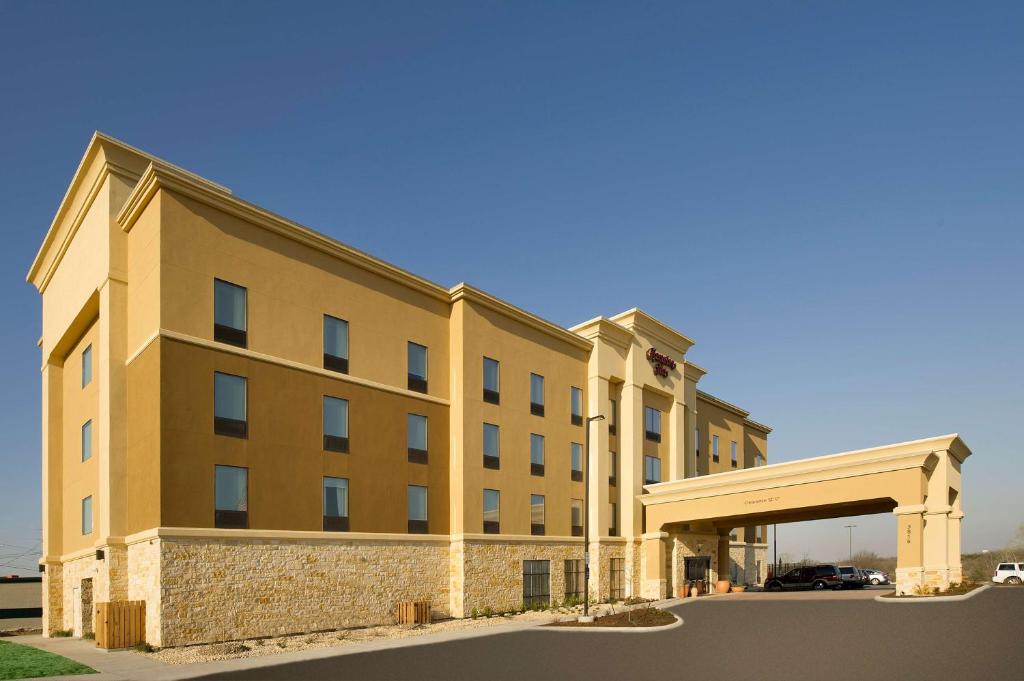 a rendering of a hotel with a parking garage at Hampton Inn Temple in Temple