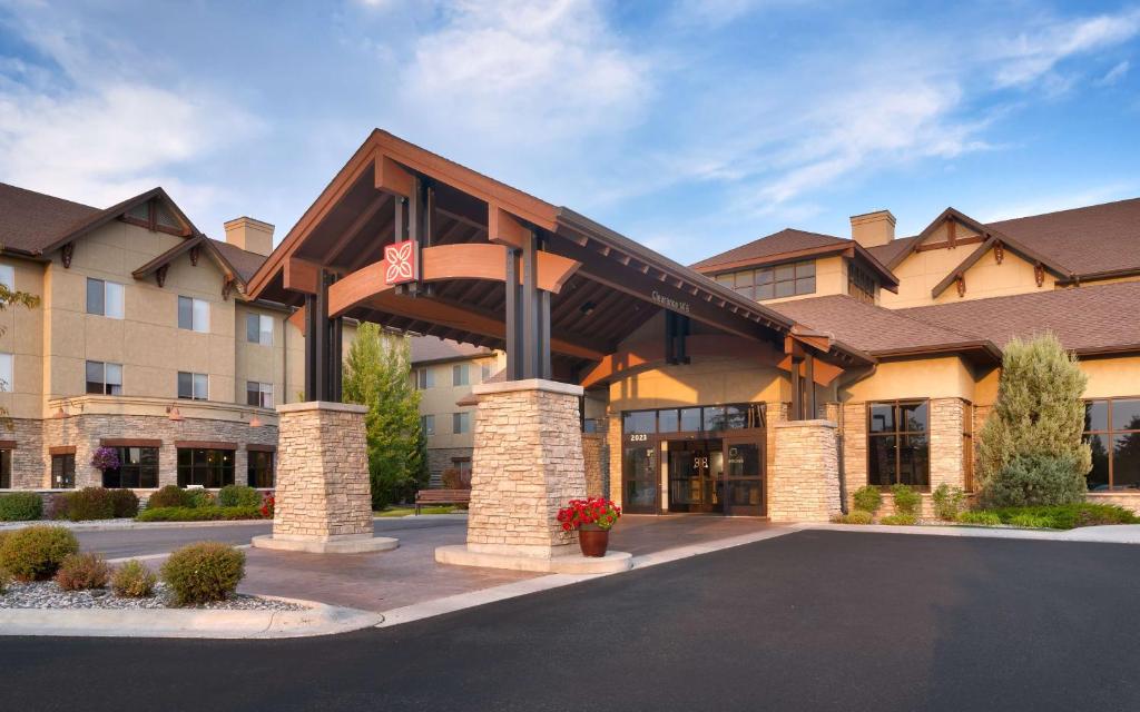 a hotel front of a building with a parking lot at Hilton Garden Inn Bozeman in Bozeman