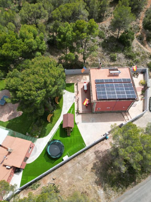 an aerial view of a house with a solar roof at Eco-hotel Aire de Monte in Náquera