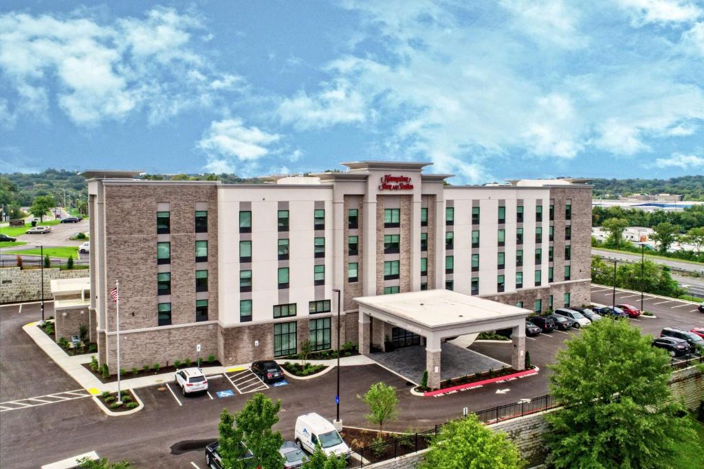 a large white building with a pavilion in a parking lot at Hampton Inn & Suites Nashville/Goodlettsville Tennessee in Goodlettsville