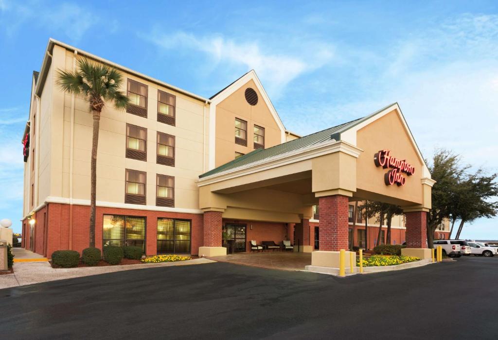 a hotel with a sign on the front of it at Hampton Inn Georgetown-Marina in Georgetown