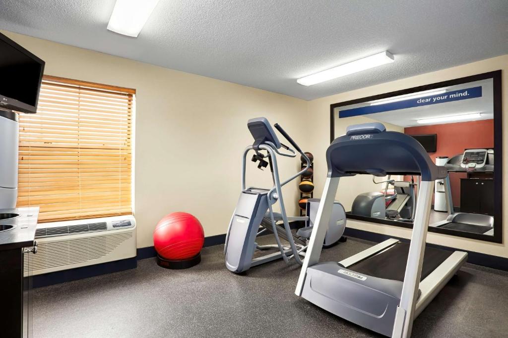 a room with a gym with a treadmill and a mirror at Hampton Inn Georgetown-Marina in Georgetown