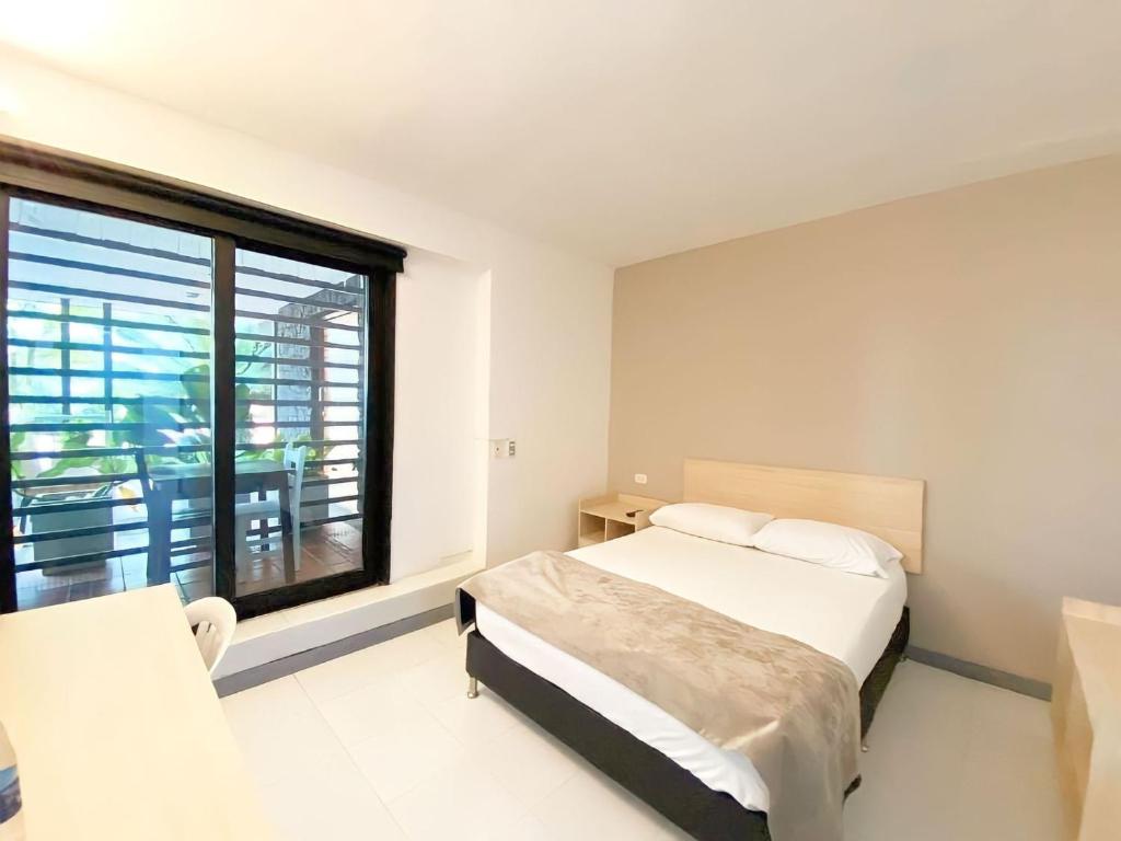 Voodi või voodid majutusasutuse Ayenda 1224 Pixel House toas