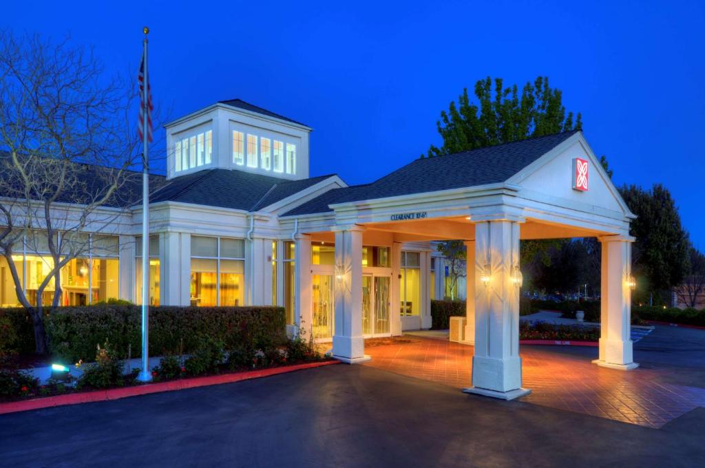 a white house with a gazebo at night at Hilton Garden Inn Livermore in Livermore