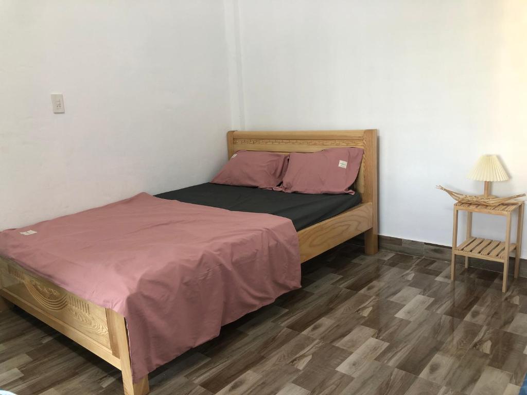 Postel nebo postele na pokoji v ubytování Xuka Homestay