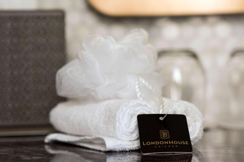 a pile of towels sitting on top of a table at LondonHouse Chicago, Curio Collection by Hilton in Chicago