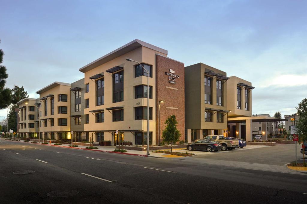 a building on the side of a city street at Homewood Suites by Hilton Palo Alto in Palo Alto