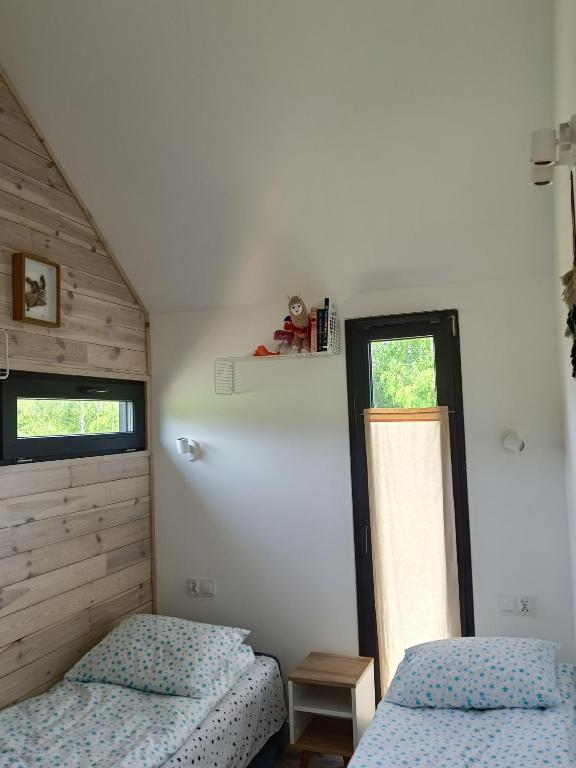 Postel nebo postele na pokoji v ubytování Pod Gwiazdami