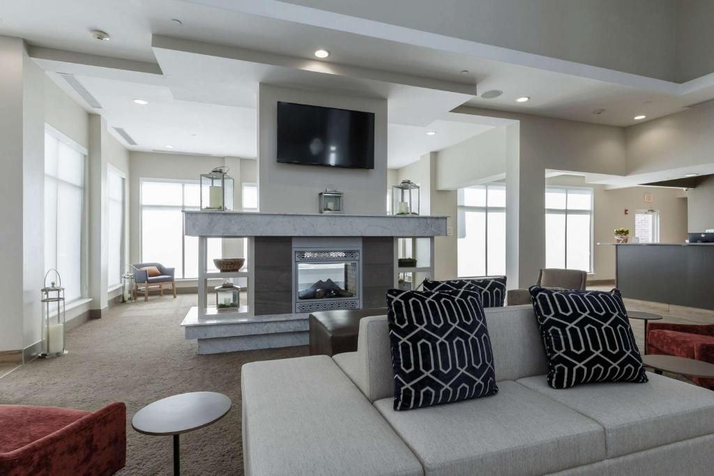 a living room with a couch and a fireplace at Hilton Garden Inn Elkhart in Elkhart