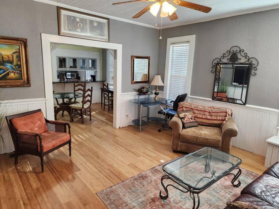 a living room with a couch and a table at Southern Comfort in Tallahassee