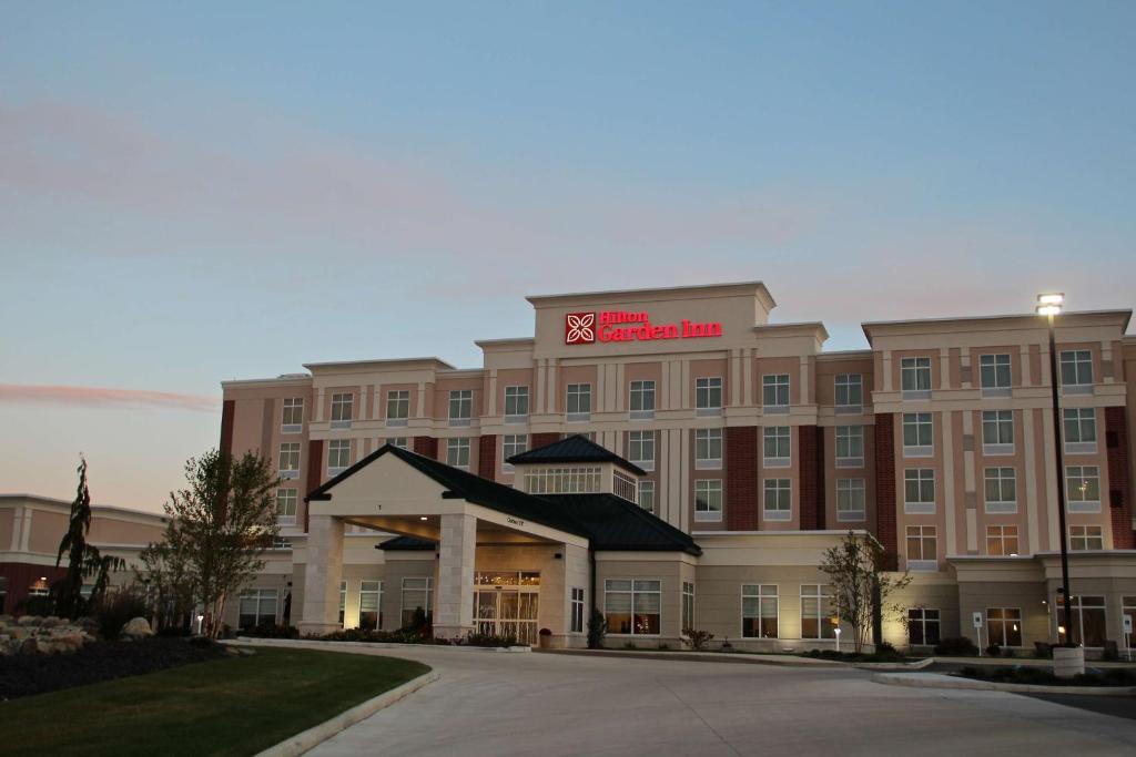 a hotel with a sign on the front of it at Hilton Garden Inn Findlay in Findlay