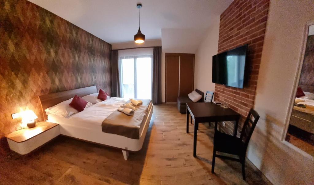 Postel nebo postele na pokoji v ubytování Penzión Modrá ryba