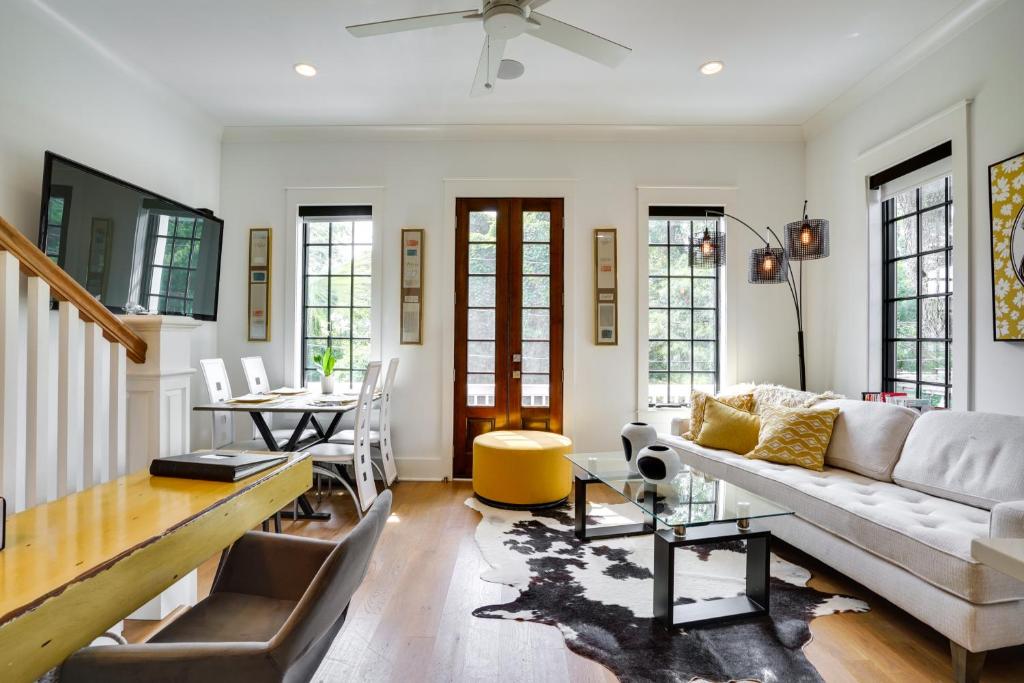 a living room with a couch and a table at Lovely Mt Pleasant Townhouse with Central Location! in Charleston