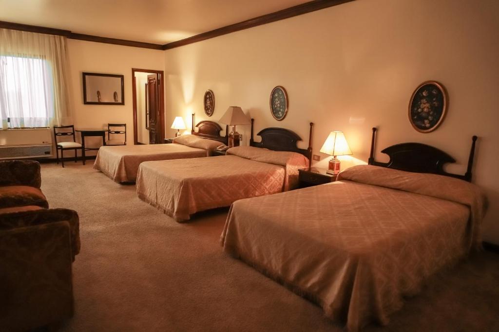 Nobile Suites Excelsior Asuncion客房内的一张或多张床位
