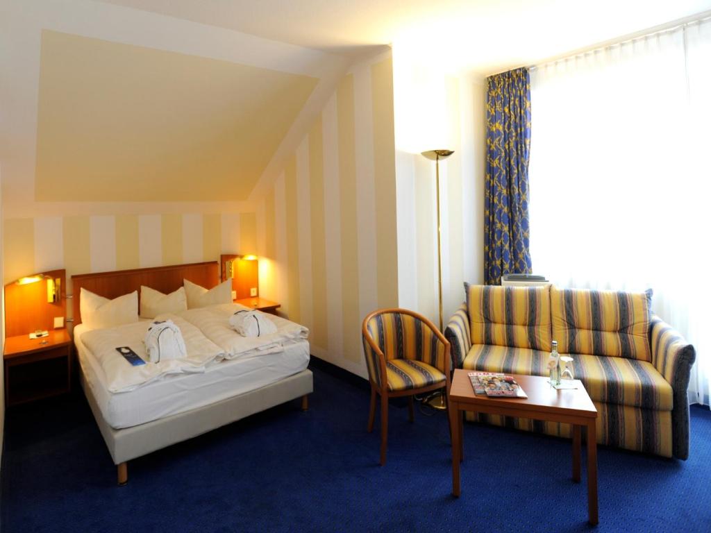 Postel nebo postele na pokoji v ubytování Radisson Blu Hotel Halle-Merseburg