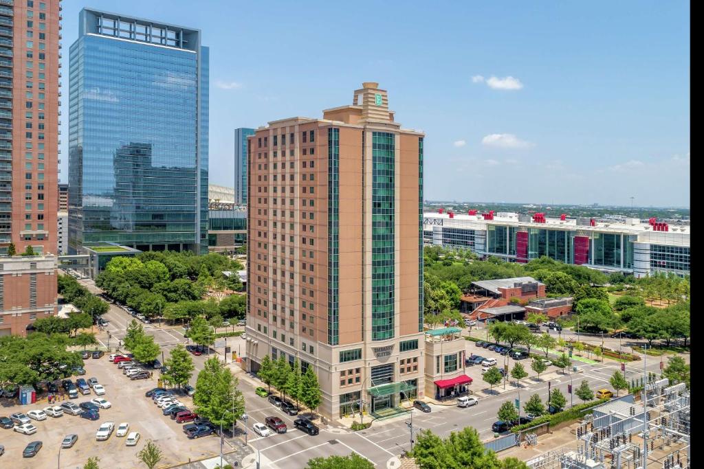 an aerial view of a tall building in a city at Embassy Suites Houston - Downtown in Houston