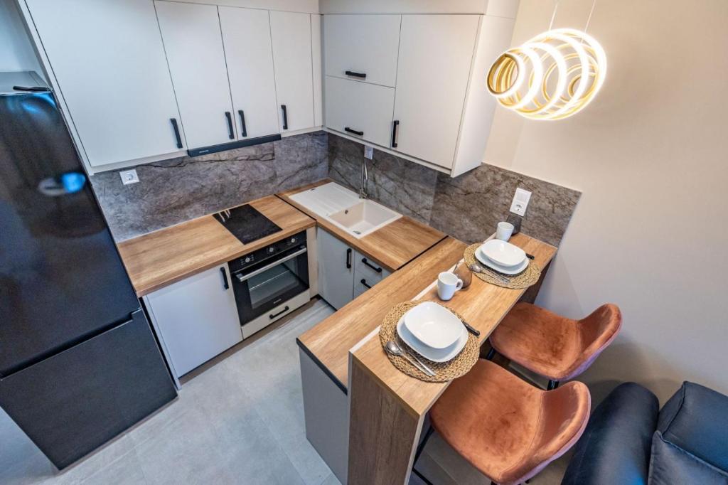 Kuchyň nebo kuchyňský kout v ubytování Rigel Apartments 1