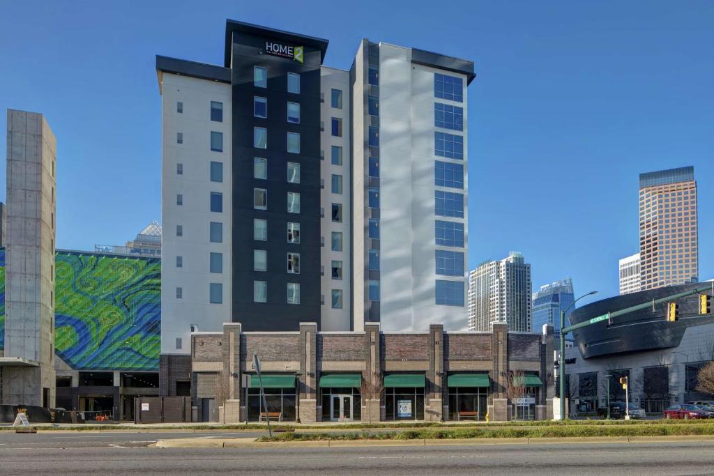 a building in a city with tall buildings at Home2 Suites By Hilton Charlotte Uptown in Charlotte