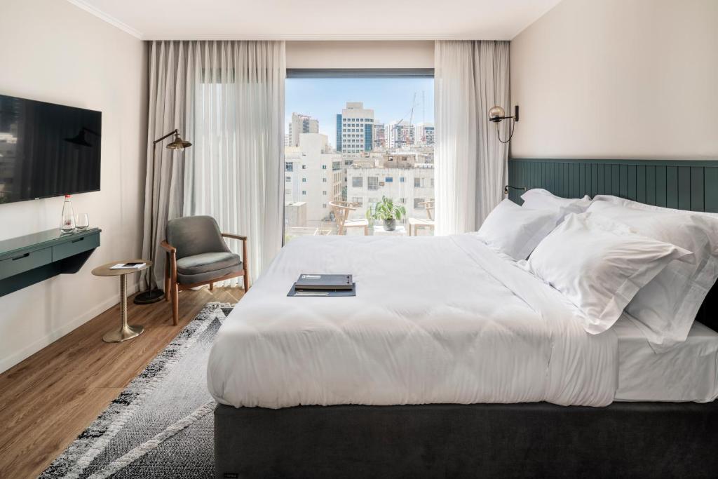 Postel nebo postele na pokoji v ubytování Jo Shtibel Tel-Aviv