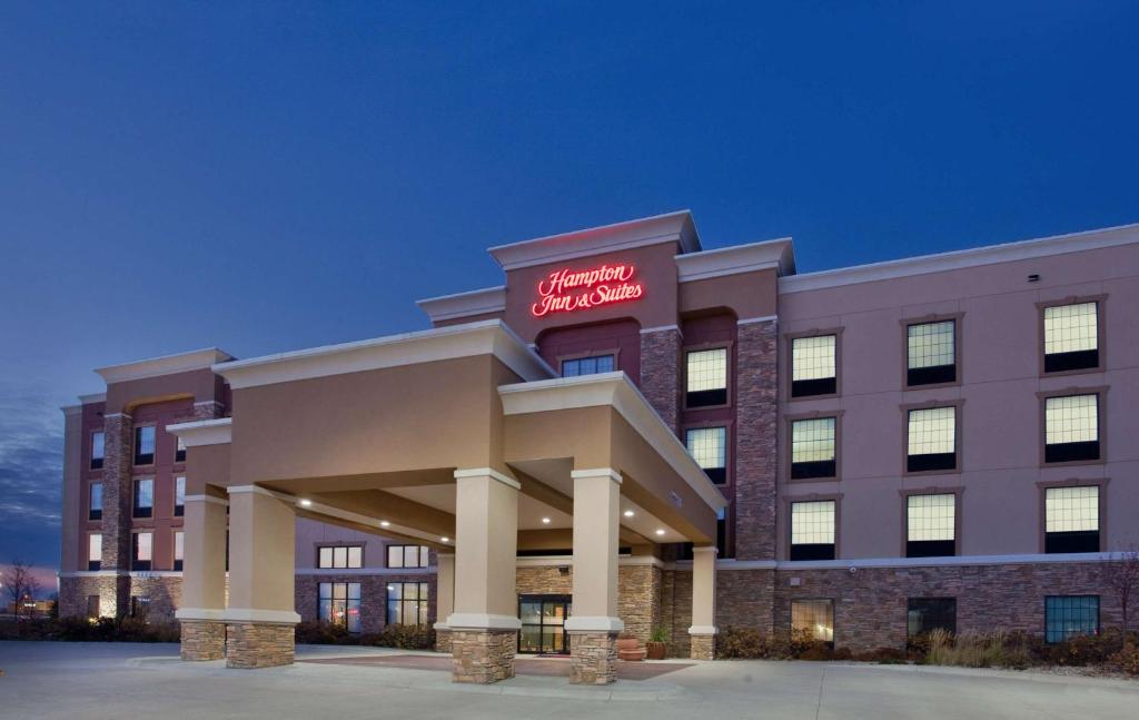 a hospital building with a red sign on it at Hampton Inn and Suites St. Cloud in Saint Cloud